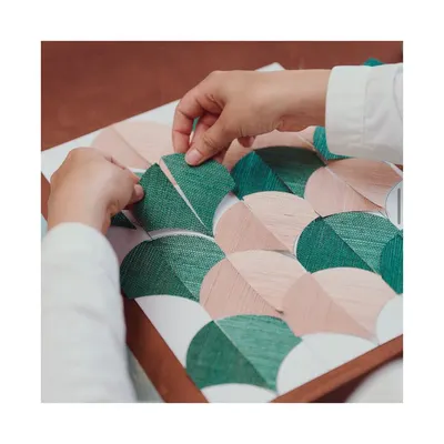 Craftsmanship and excellence are at the heart of what I do. This behind-the-scenes snapshot shows a wallpaper in the making, where each piece is hand-assembled. I source from artisans who treat every wallcovering as a work of art.