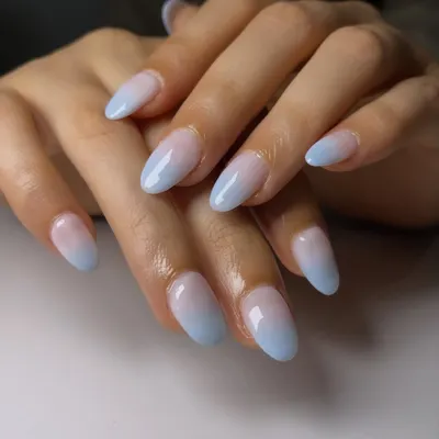 A perfect example of a seamless fade from a blush pink base to a soft baby blue tip. This is the art of the ombré, creating a gentle and beautiful color transition.