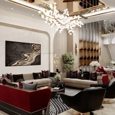 This double-height living room is designed for luxurious events and comfortable family moments. The design features a dramatic art piece, a mix of bold red and neutral tones, and a stunning chandelier to create a grand yet inviting atmosphere.