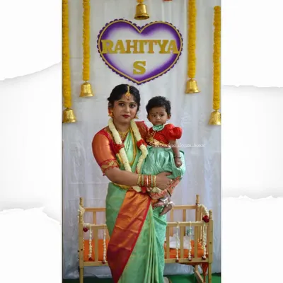 A heartwarming moment with a mother and daughter duo in their matching outfits for a naming ceremony. I designed a simple, elegant saree and blouse for mom, with a cute matching dress for her baby.