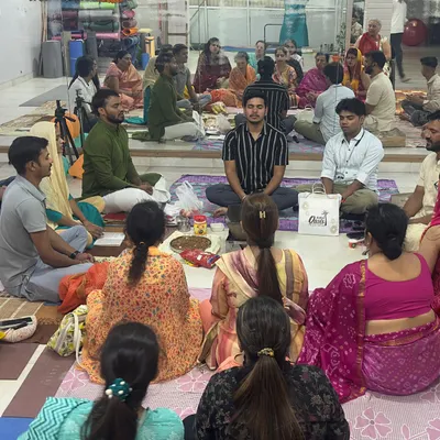 A wide shot of our community gathered for a Hawan ceremony at the yoga center, filling the space with sacred energy.