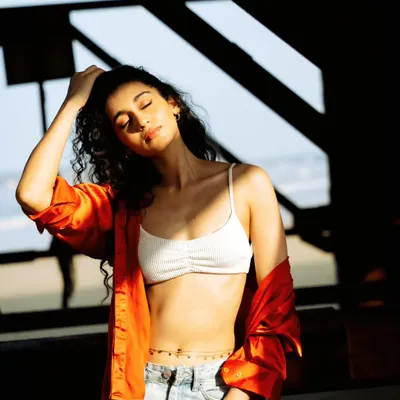 Capturing that perfect sun-kissed moment. The play of light and shadow under this old Mumbai pier created a naturally beautiful frame for this portrait.