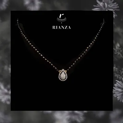 An elegant and modern mangalsutra featuring a pear-shaped diamond pendant. This design is a statement of style that a modern married woman can flaunt every day.