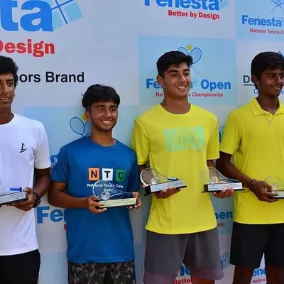 NTC player Cahir Warik and his partner Rushil Khosla holding their trophies after winning the Fenesta Nationals Doubles U-18 title.