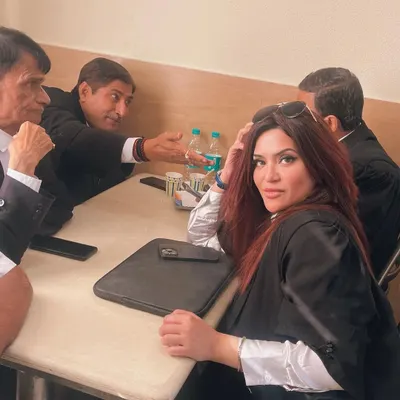 A candid moment during a discussion with fellow advocates at the Supreme Court. These informal conversations over coffee are often where the most insightful legal strategies are born.