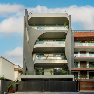 Presenting Lotus Villa, a sculptural facade that speaks the language of fluid architecture. Designed with sweeping concrete forms and full-glass balconies, the facade mimics natural movement while maintaining a strong urban character.