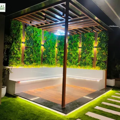 A completed pergola in Sonipat with built-in L-shaped seating, vertical garden walls, and integrated lighting.