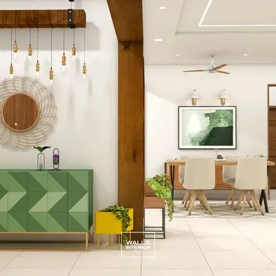 A vibrant green sideboard with a geometric chevron pattern on the doors. Paired with a rustic wooden beam light fixture, this piece makes a bold statement in the dining area.