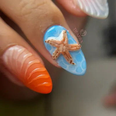 A close-up of a hand-sculpted 3D starfish on a nail with a realistic water pool effect, next to a vibrant orange seashell-textured nail.