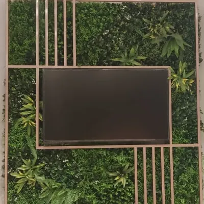 For the Biba showroom in Salem, I designed and installed this artificial green wall as a backdrop for a media screen, bringing a touch of nature into a commercial retail space.