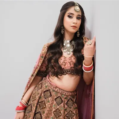 A modern bridal look featuring soft waves and a subtle smokey eye, perfect for pre-wedding functions. Our courses teach you to create versatile looks for every ceremony.