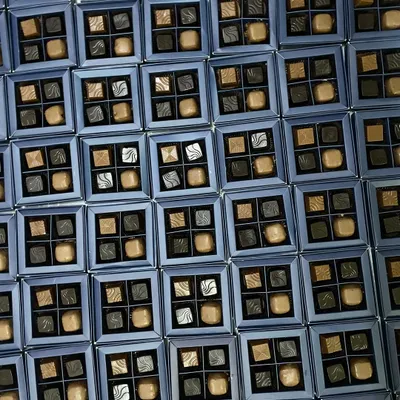 Gifting never tasted so divine. A large order of our four-piece artisanal chocolate boxes, ready for a corporate event or as wedding favors.