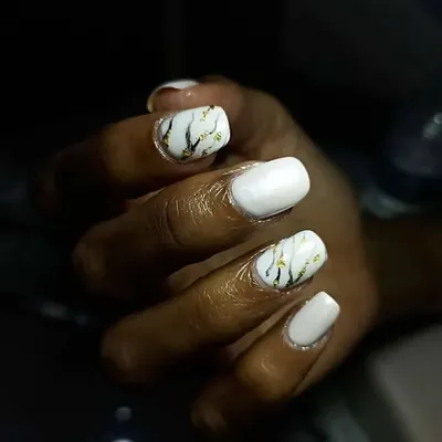 I love creating these uber classy and chic marble nails. This design features white marble with black and gold veins for a sophisticated, stone-like effect.