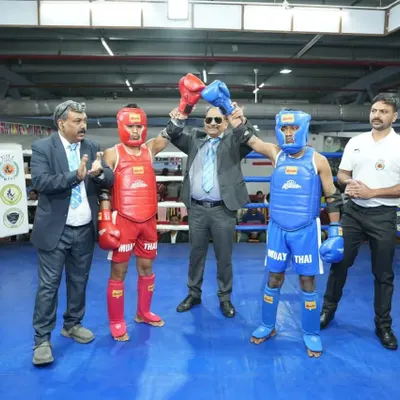A proud moment at the 4th National Muay Thai Championship. The referee raises my student's hand in victory, a reward for all the hard work and dedication in the gym.