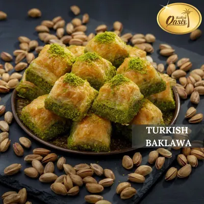 A close-up of our Turkish Pistachio Baklava, generously filled with finely ground pistachios and dusted with more on top. A true classic.