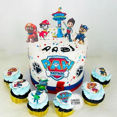 Paw Patrol is on a roll. This birthday cake features the whole team with Ryder, Chase, and Marshall, complete with the iconic Paw Patrol logo and matching character cupcakes.