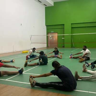 Flexibility prevents injuries and improves reach. Here, a group cools down with post-training stretches, an important part of our daily regimen for recovery and muscle health.