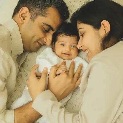 There's nothing sweeter than a baby's first smiles. Capturing this moment of joy between new parents and their little one is what I love to do.