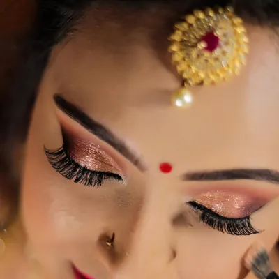 A close-up of these stunning shimmery reception eyes. I use a combination of matte and glitter shadows to create depth and dimension.