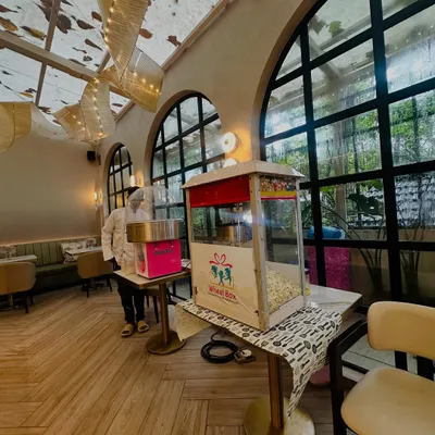 Our popcorn and cotton candy stations set up side-by-side in a beautiful, airy venue. We handle the entire setup and service, so you can relax and enjoy.