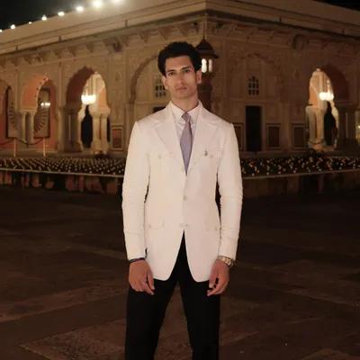 We were honored to dress Mr. Vipul Juneja in this bespoke white linen suit for an event at the majestic Jaipur City Palace. It's a look that exudes royal elegance and timeless style.