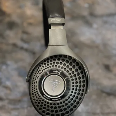 A detailed close-up of the Focal Bathys wireless headphones. The craftsmanship is evident in the aluminum and magnesium materials, and the design delivers pure high-fidelity sound.