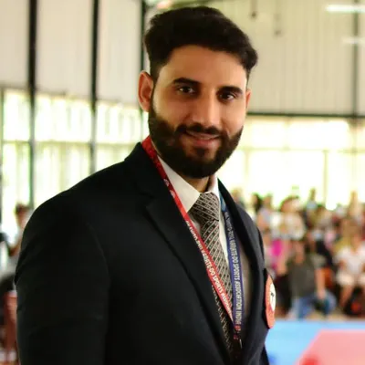 A portrait of me, Shihan Ashish Kumar. As the founder and coach, I am personally invested in every student's growth, guiding them to become not just skilled martial artists but also confident individuals.