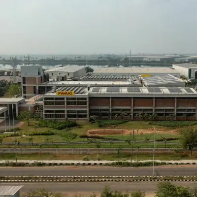 This is the award-winning factory we designed for Fanuc India in Chennai, which showcases our approach to sustainable industrial architecture. The building incorporates natural materials like exposed brick and is designed to harmonize with its surrounding landscape, challenging the traditional look and feel of a factory.