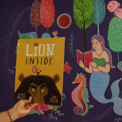 In our 'Sea of Stories' library, we read "The Lion Inside" to a group of children who are deaf and mute. The story was held up against our beautiful underwater mural, creating a truly immersive experience. It was a quiet, moving session that showed how stories can connect us all.