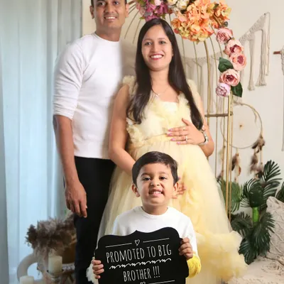 This little guy is so excited to be a big brother. Using props like this chalkboard sign makes for a super cute and personal pregnancy announcement that includes the older sibling.