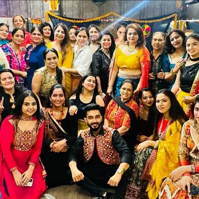 A group photo capturing the vibrant energy of our Dandiya Night. Look at all the beautiful smiles and traditional outfits. This is our fit fam celebrating Navratri together.