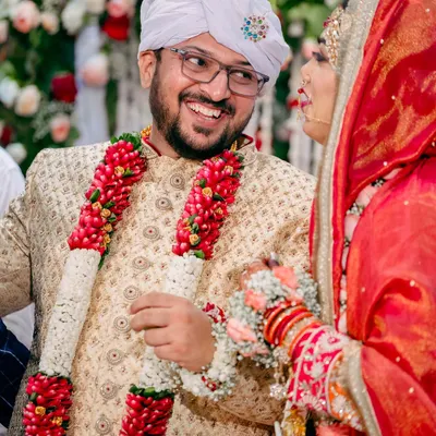 A candid moment of joy between the bride and groom during their Nikah ceremony. Capturing these genuine smiles is what makes a wedding album feel alive.