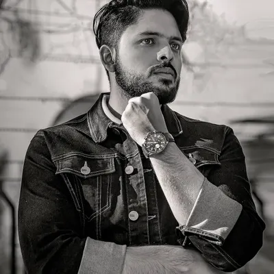 A classic black and white portrait for a men's lookbook. The strong pose and crisp monochrome edit create a timeless and stylish feel.