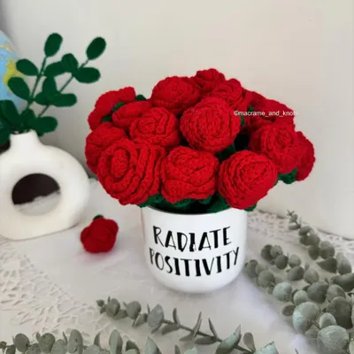 A beautiful bouquet of handmade crochet red roses. These flowers will never fade, making them a perfect symbol of everlasting love.