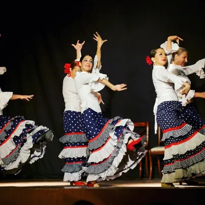 On stage performing Flamenco with my talented fellow dancers. The vibrant costumes and coordinated movements are a huge part of this powerful dance style, which I had the pleasure of learning from Paola Santa Cruz.