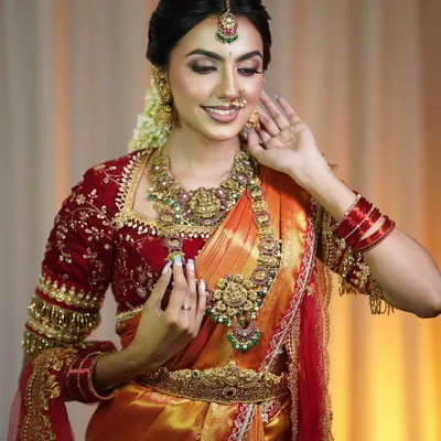 A closer look at this evergreen bridal outfit. The detailed work on the velvet blouse and the way the silk saree drapes is what makes this look so special for a bride's big day.