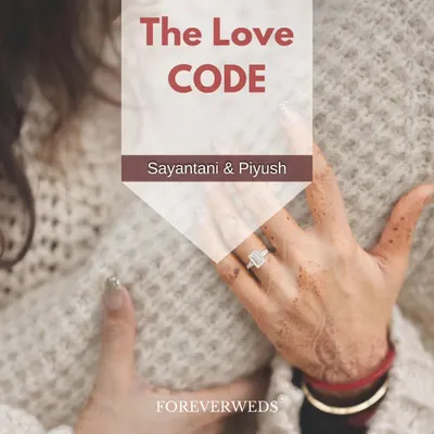 Every couple has their own love code. This pre-wedding album cover for Sayantani and Piyush was designed to capture the intimacy and promise of their journey together, focusing on the detail of the engagement ring.