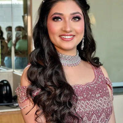 The princess diaries are real! This close-up shows off the beautiful pink-toned smokey eye and flawless skin, a perfect combination for a modern sangeet or reception look.