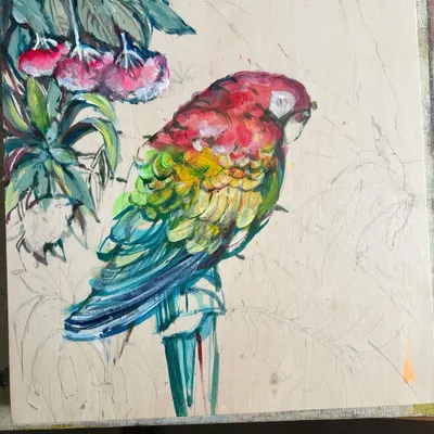 Trust the process. This is a work-in-progress shot of my acrylic macaw painting on wood, showing the layers of color being built up to create the vibrant feathers.