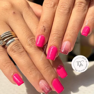 A bright and cheerful set featuring a vibrant pink gel polish. The accent nails have a soft pink ombre with a touch of glitter for extra fun.