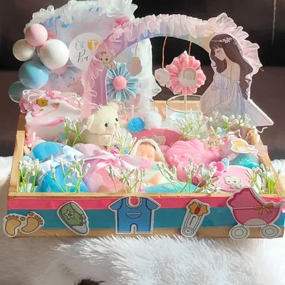 This is one of my most elaborate "Mom to be" hampers. It's a treasure trove of handmade soaps, lotions, candles, and other goodies, all beautifully decorated to celebrate the new arrival.
