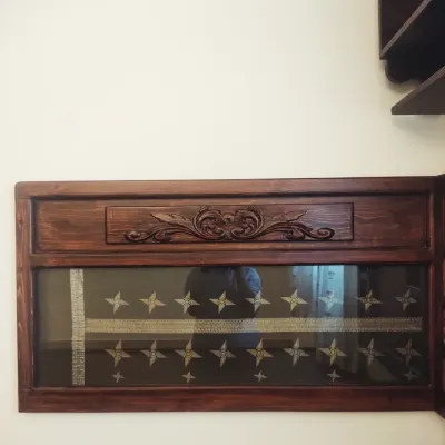 The heart of this project: a piece of a family wedding sari, a gift of immense sentimental value, carefully preserved between ply and glass. We integrated this into the headboard, making it a permanent and cherished part of the room's story.