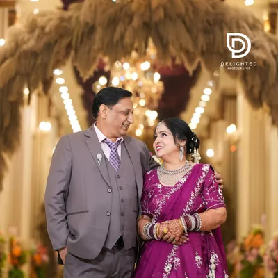 A beautiful portrait from a 25th wedding anniversary celebration. The loving glance they share after so many years together is a testament to their enduring bond.