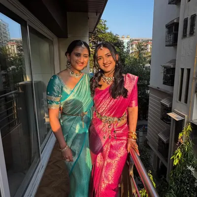 I had the pleasure of draping these two sisters for their cousin's wedding. They chose beautiful, vibrant silk sarees in teal and pink, and I created complementary drapes for a coordinated and elegant look.