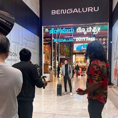 Here I am on set at Bengaluru International Airport for a multi-day ad shoot. This shot shows the scale of the production, with the crew setting up for a scene in the duty-free area.