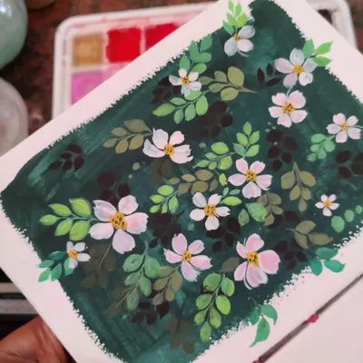 An example of my work with gouache, featuring delicate white flowers against a dark green background. The opacity of gouache allows for this beautiful contrast, making the flowers pop.