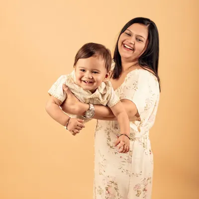 The best family portraits are the ones filled with laughter. This mother and baby studio session was full of pure, unscripted joy.