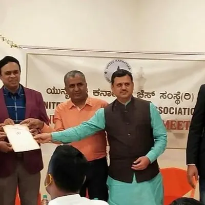 I am pictured here receiving the official affiliation certificate for Panchajanya Chess Academy from the leadership of the United Karnataka Chess Association (UKCA). This formal recognition underscores our professional standing.