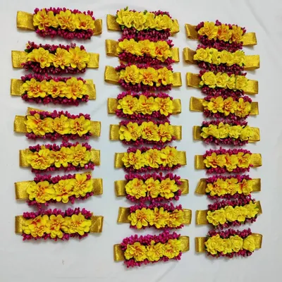 These vibrant yellow and pink floral bracelets are perfect for the bridesmaids at a Haldi or Mayoon ceremony. They add a pop of color and unify the whole bride tribe.