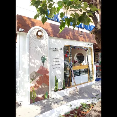 The finished exterior of the 'Sun Kissed' smoothie bar. The mural is designed to be bright, inviting, and perfectly on-brand.